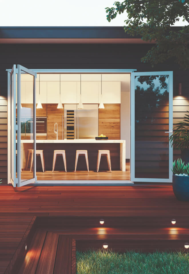 Duco bifolding door in a white colour opening onto a deck