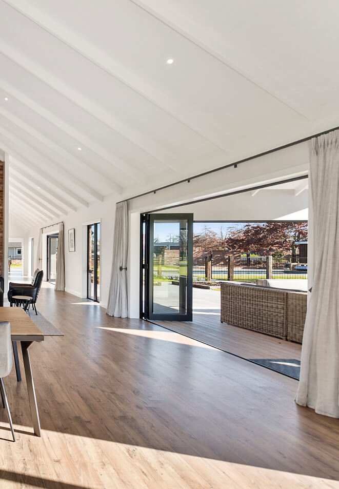 Duco bifolding door opening onto a deck