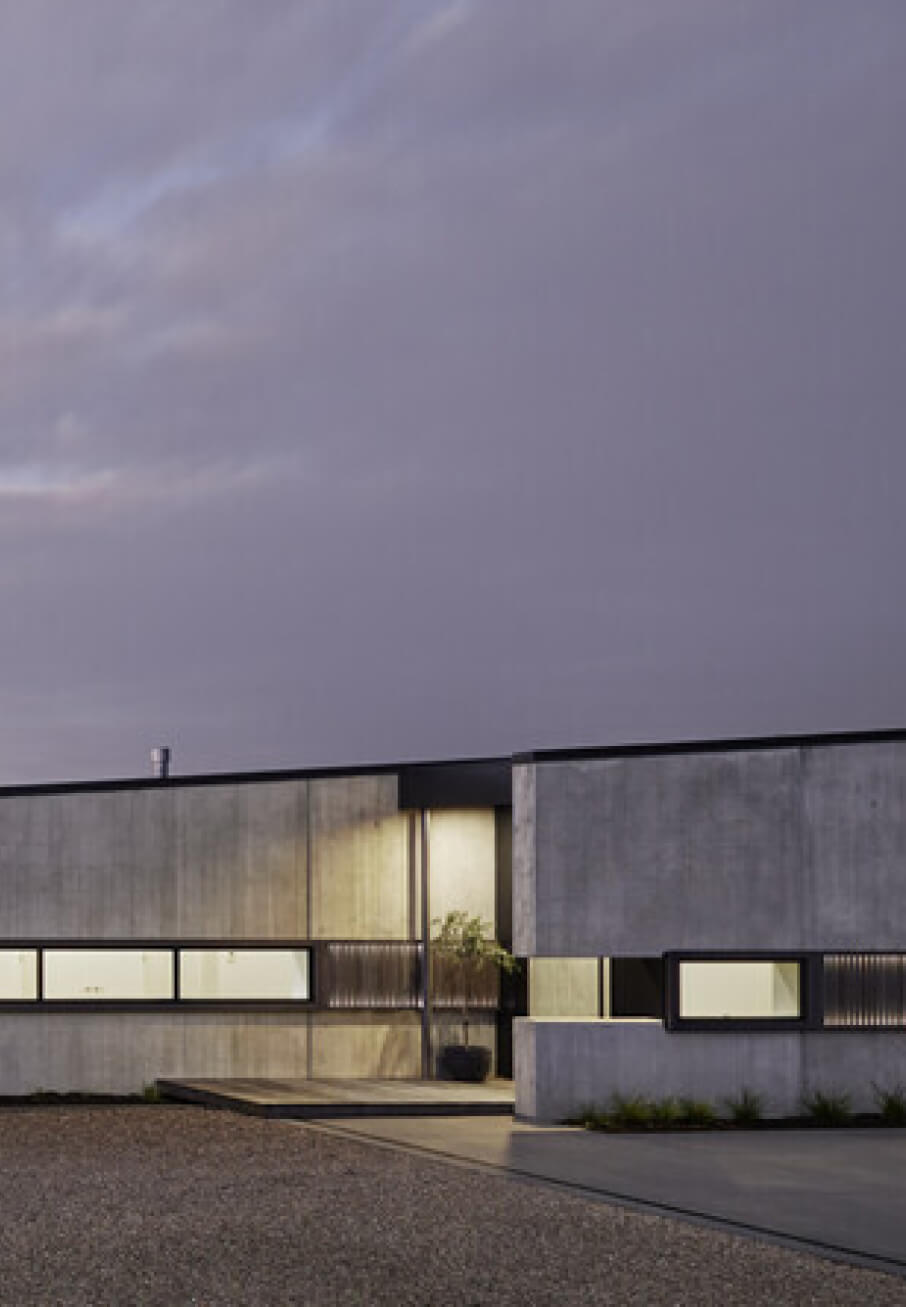 Duco sliding windows set into the front of a house - black design