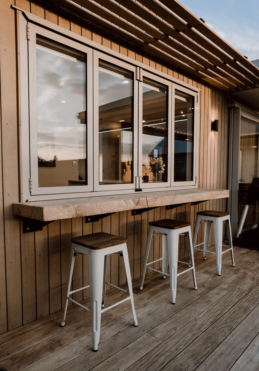 Duco bifold windows in a linking the inside to the outside of the house