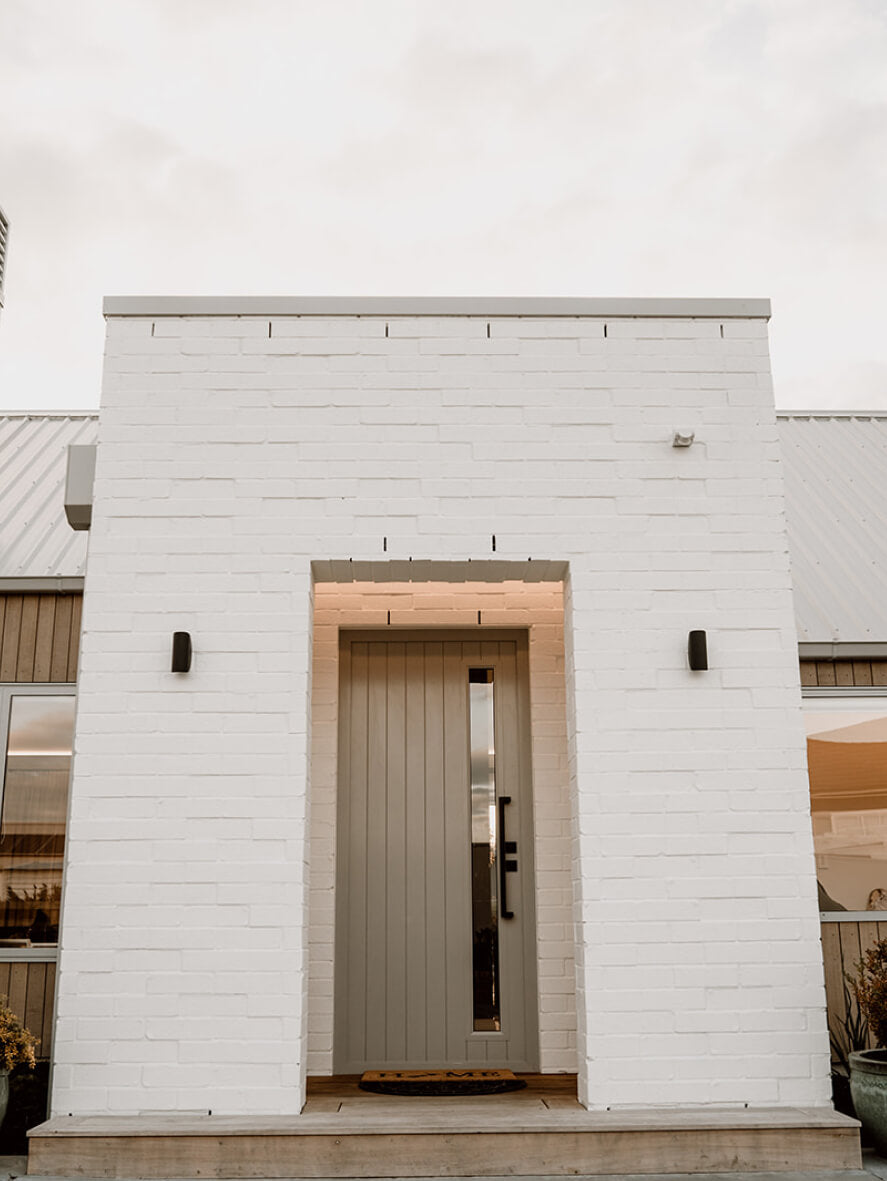 Duco entry door grey displayed in a house