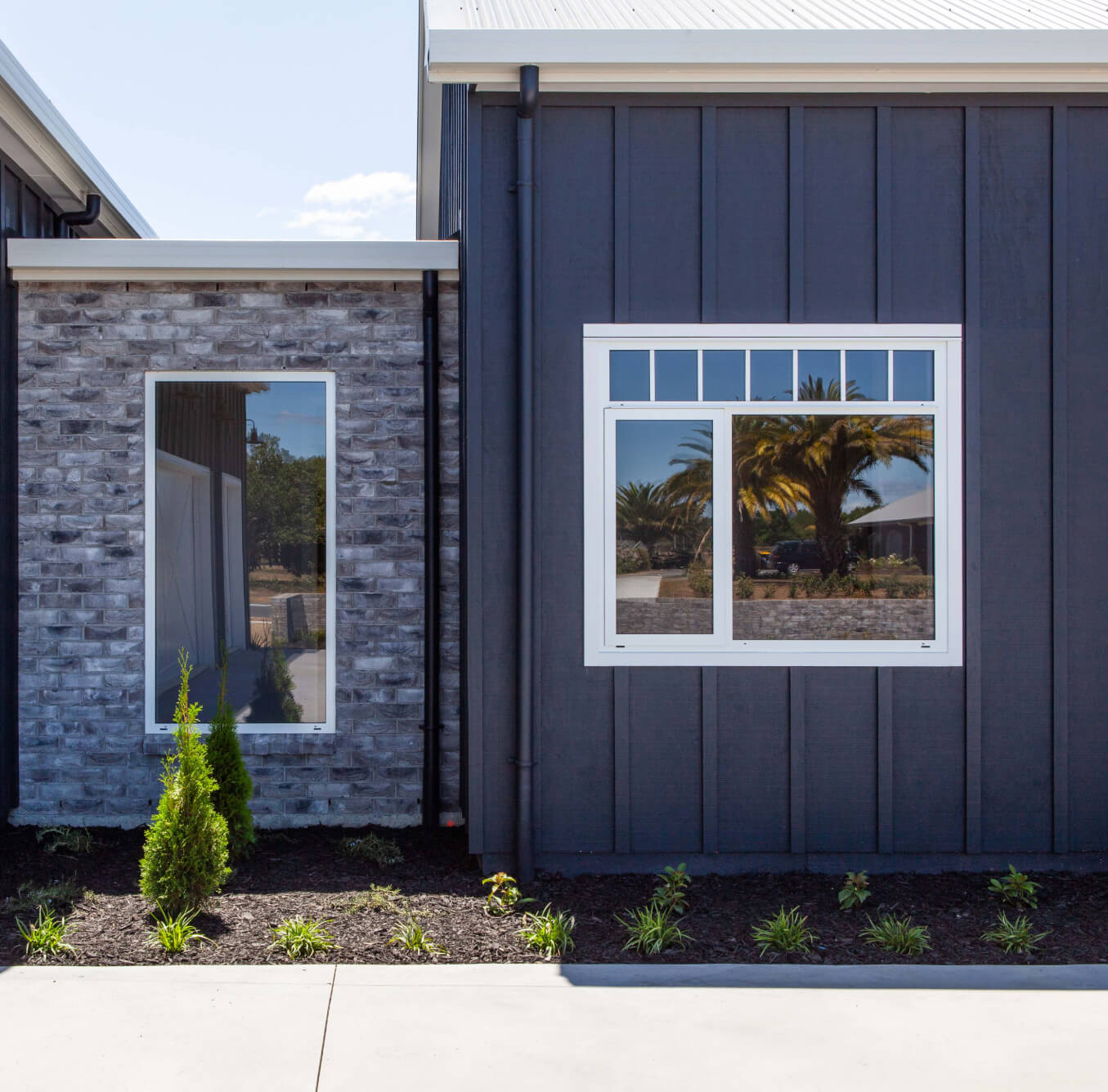 Duco fixed windows. Single panel and Double panel on an adjacent wall of a house