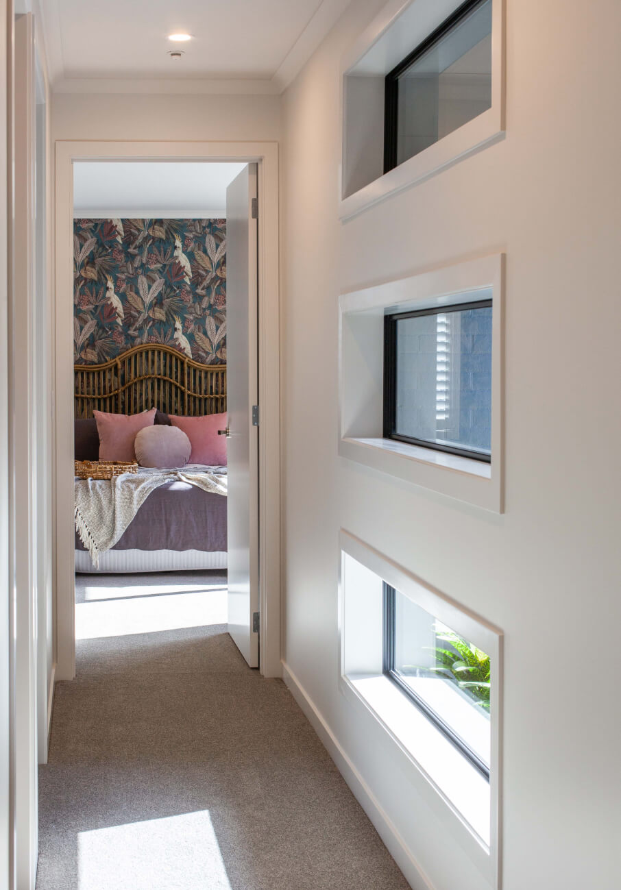 Duco windows stacked above each other in a hallway