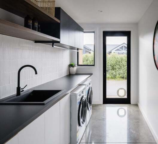 Duco Single Hinged door with a cat flap in a laundry setting