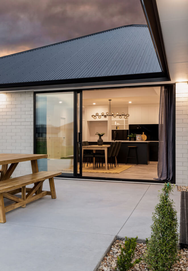 Duco Ceiling to floor sliding door image onto a deck