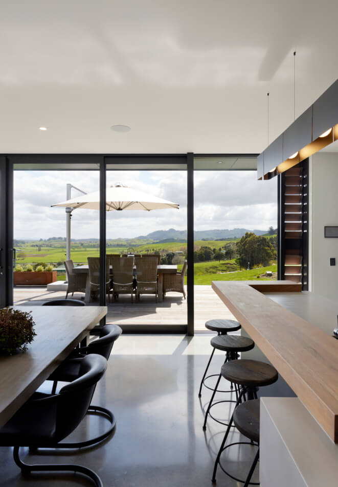 Duco Ceiling to floor sliding door image onto a deck