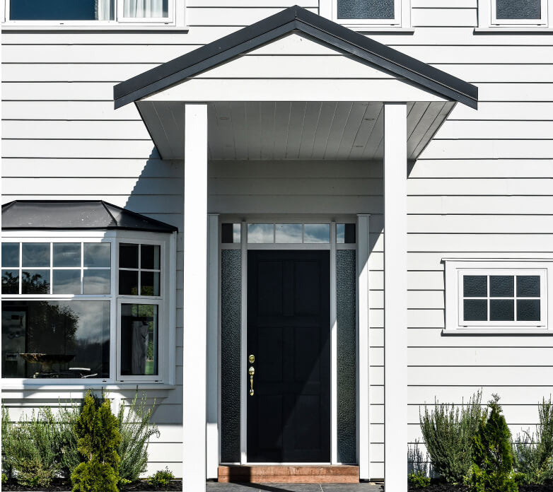 Duco entry door black with side panels displayed in a house