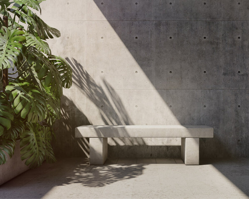 Duco image of a stone seat outside a concrete wall