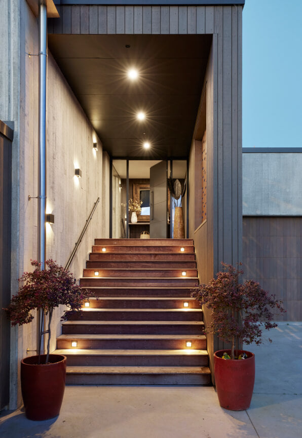 Duco entry door grey with glass sides either side of the door displayed in a house